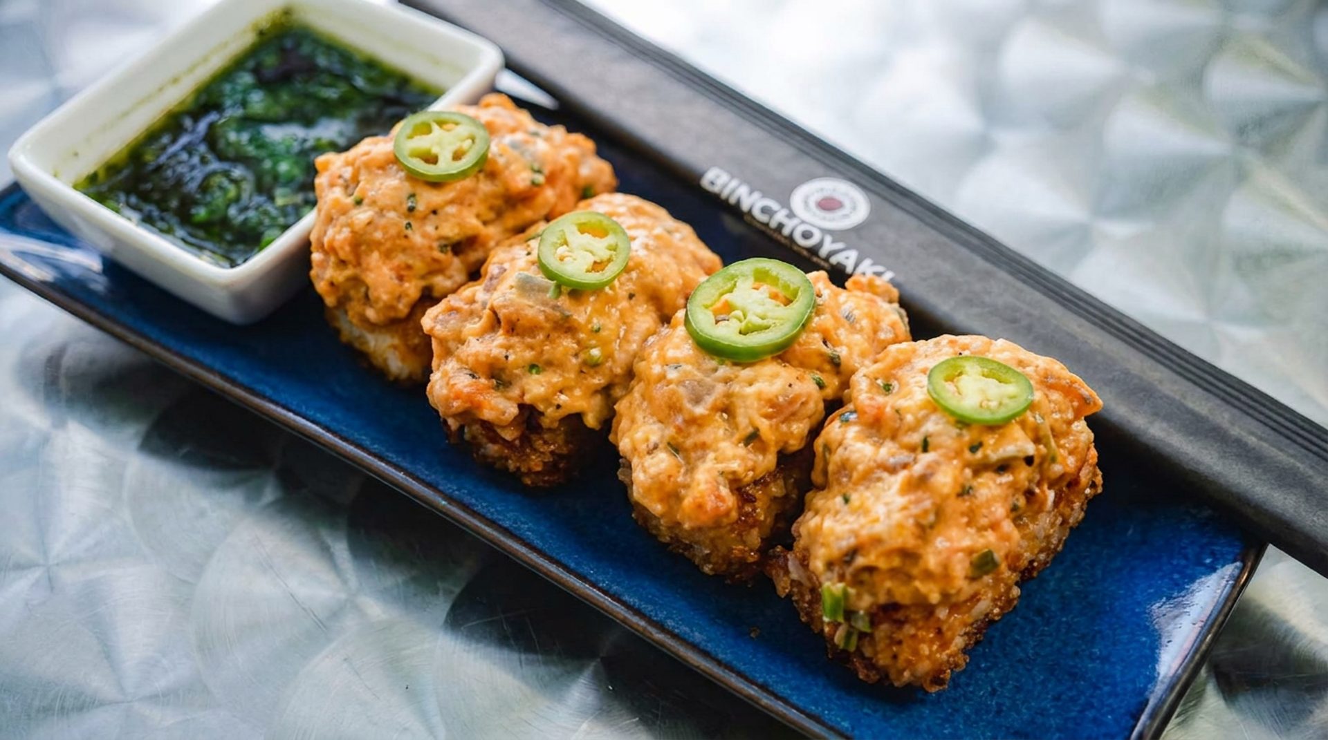 Crispy rice and pork belly skewers